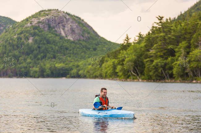 Man kayaking on Jordan Pond in Acadia National Park, Maine, USA