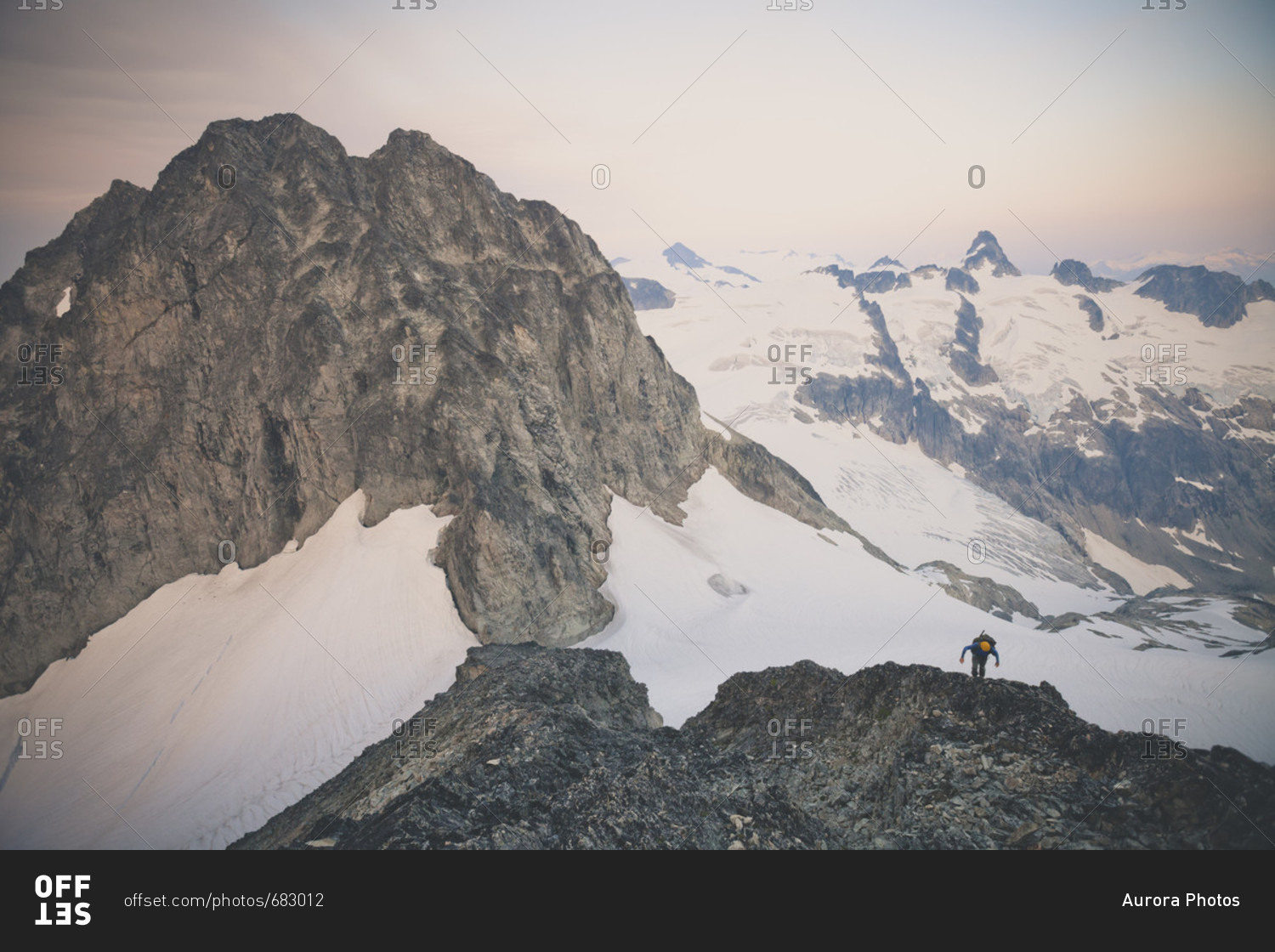 Rear view of person mountaineering on Ashlu Mountain in Coast Mountain Range of British Columbia, Canada