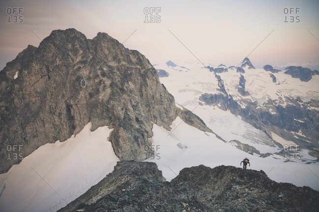 Rear view of person mountaineering on Ashlu Mountain in Coast Mountain Range of British Columbia, Canada