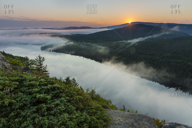 Scenery with fog above Echo Lake at sunrise, Acadia National Park, Maine, USA