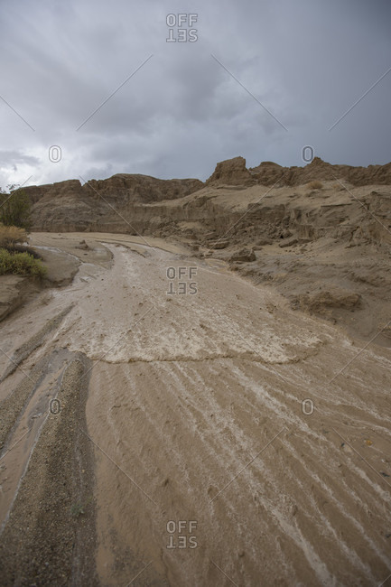 Dirt road during flash flood in badlands section of Anza Borrego State Park, California, USA