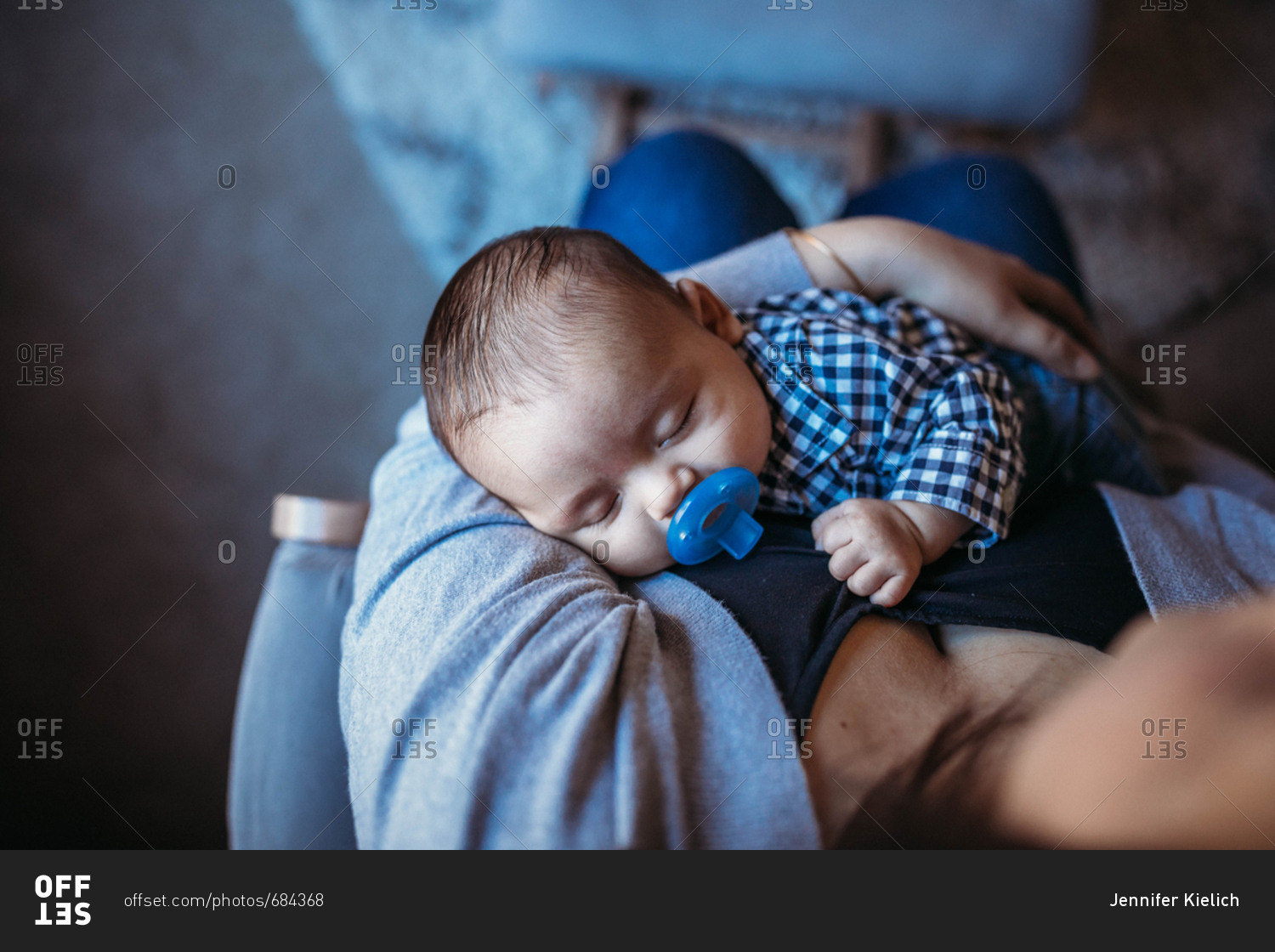 Overhead view of baby being rocked to sleep stock photo OFFSET