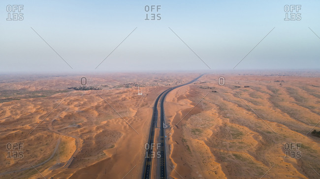 Aerial view of empty roads in the desert of Umm Al Quawain, UAE