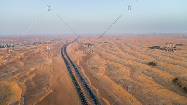Aerial view of empty roads in the desert of Umm Al Quawain, UAE