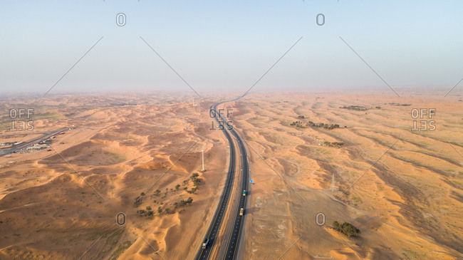 Aerial view of empty roads in the desert of Umm Al Quawain, UAE