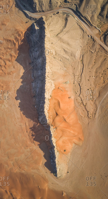 Aerial view of a rocky peak mountains in the middle of Sharjah desert, UAE