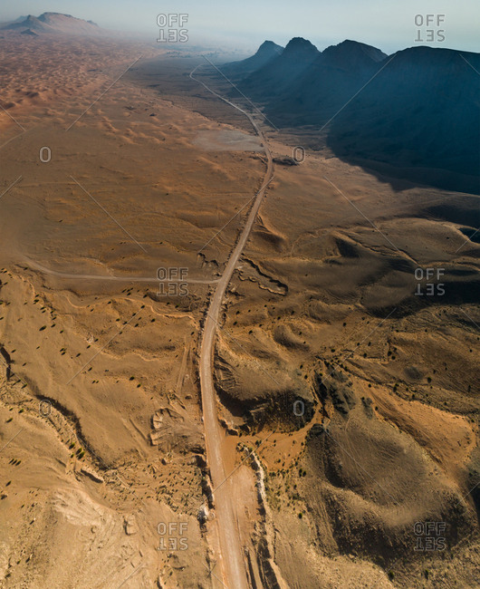 Aerial view of an empty road in the Sharjah desert, UAE