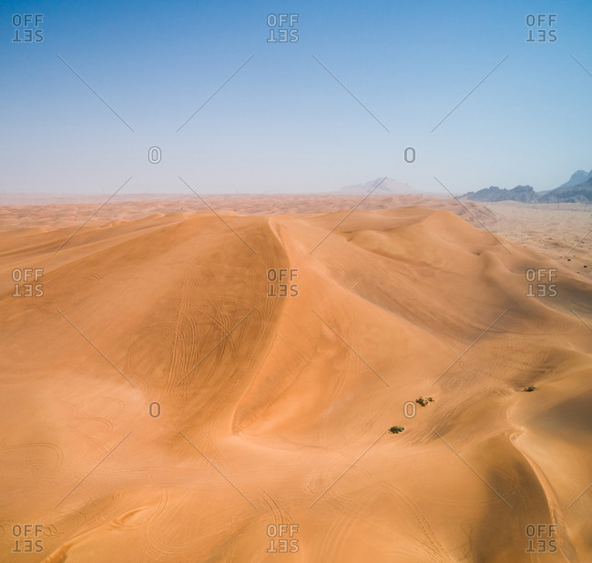 Aerial view of quad bikes track in the dunes of Sharjah desert, UAE