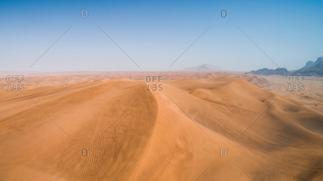 Aerial view of quad bikes track in the dunes of Sharjah desert, UAE