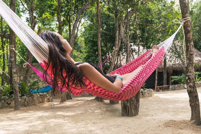Young woman relaxing in a hammock