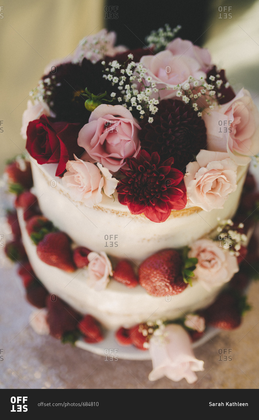 High angle close-up top tier view of floral decorated wedding cake