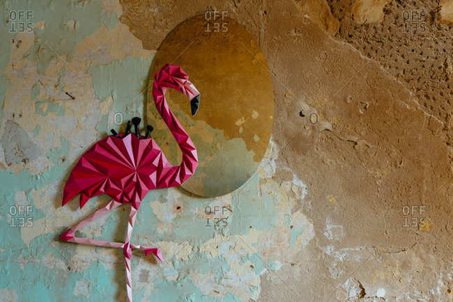 Origami flamingo bird made as home decoration shelf and a mirror