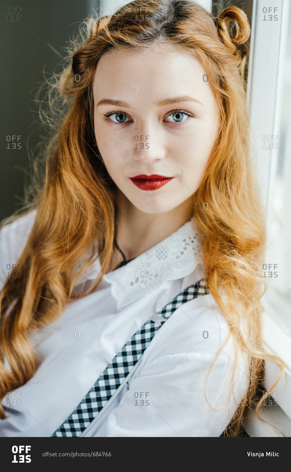 Portrait of beautiful teenager girl with long red hair and blue eyes and  pale skin stock photo - OFFSET
