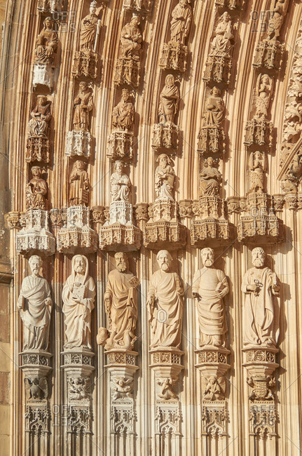 Detail of carved figures in archivolts of main portal of Batalha Monastery in Portugal