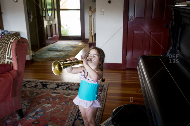 Young woman playing trombone Stock Photo