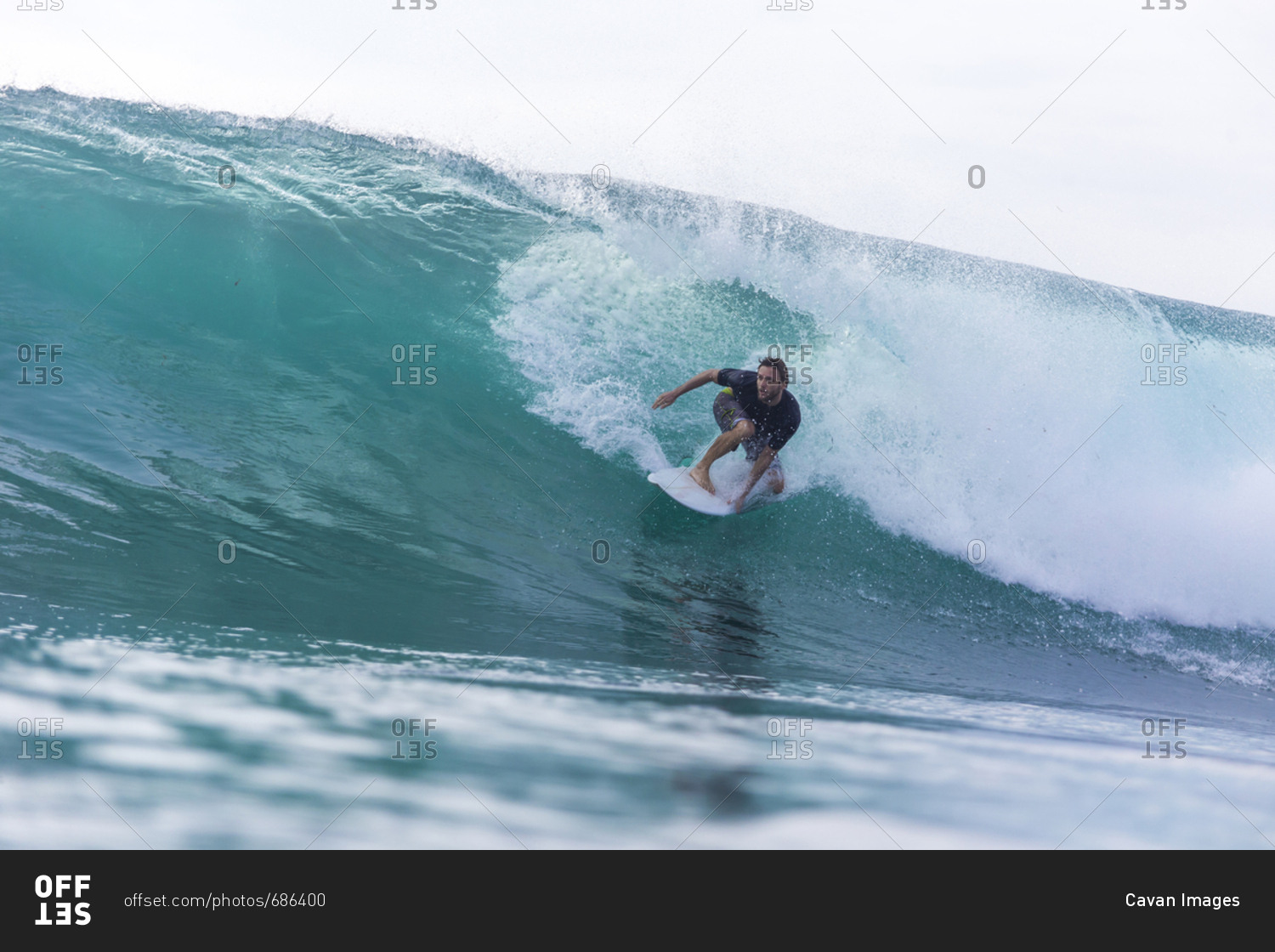 Water surface image of man surfing on sea against clear sky