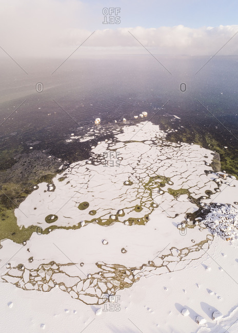Abstract aerial view of windy snowy sea of Muraste, Estonia