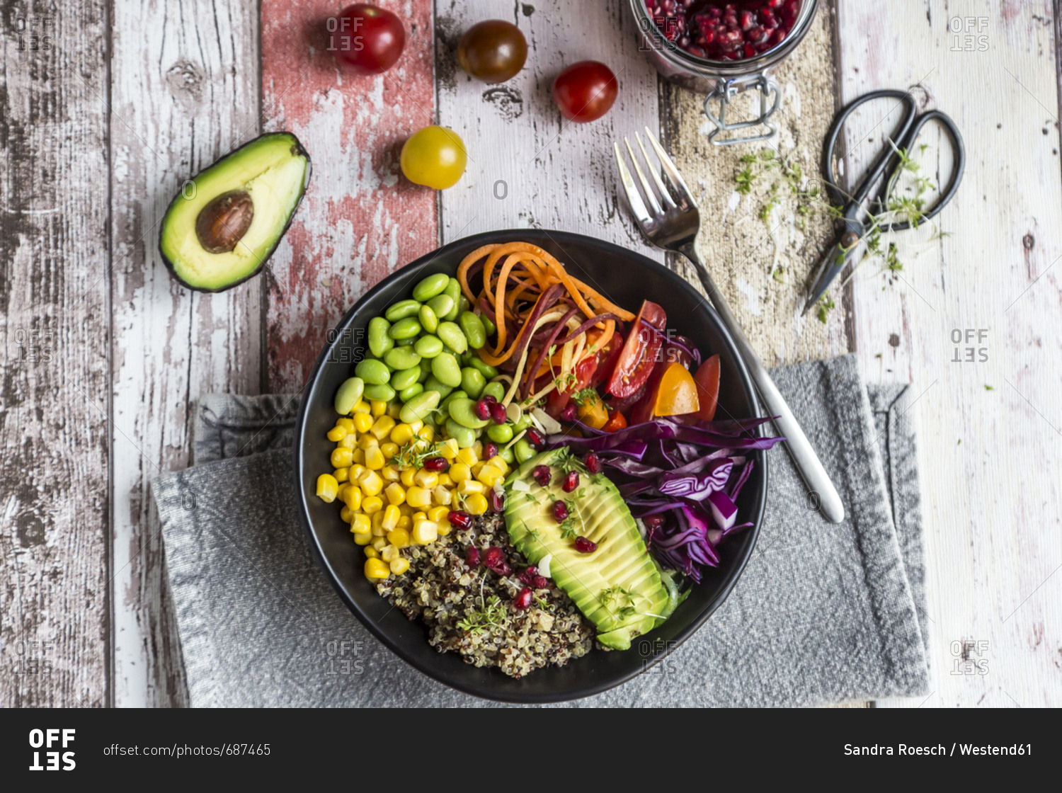 Quinoa veggie bowl of avocado- Edamame- tomatoes- corn- carrots- red cabbage and pomegranate seed