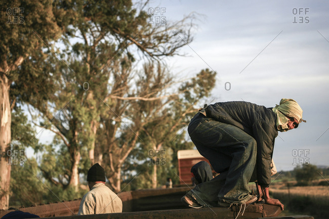 Mexico - November 07, 2007: Young migrant preparing to jump off train hoping to cross border into United States of America