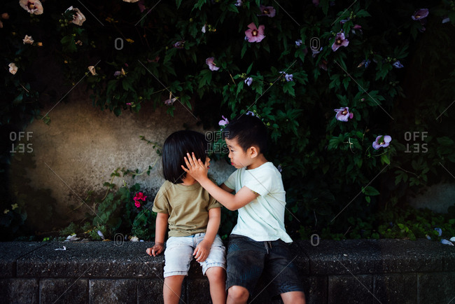 Kids sitting on a bench