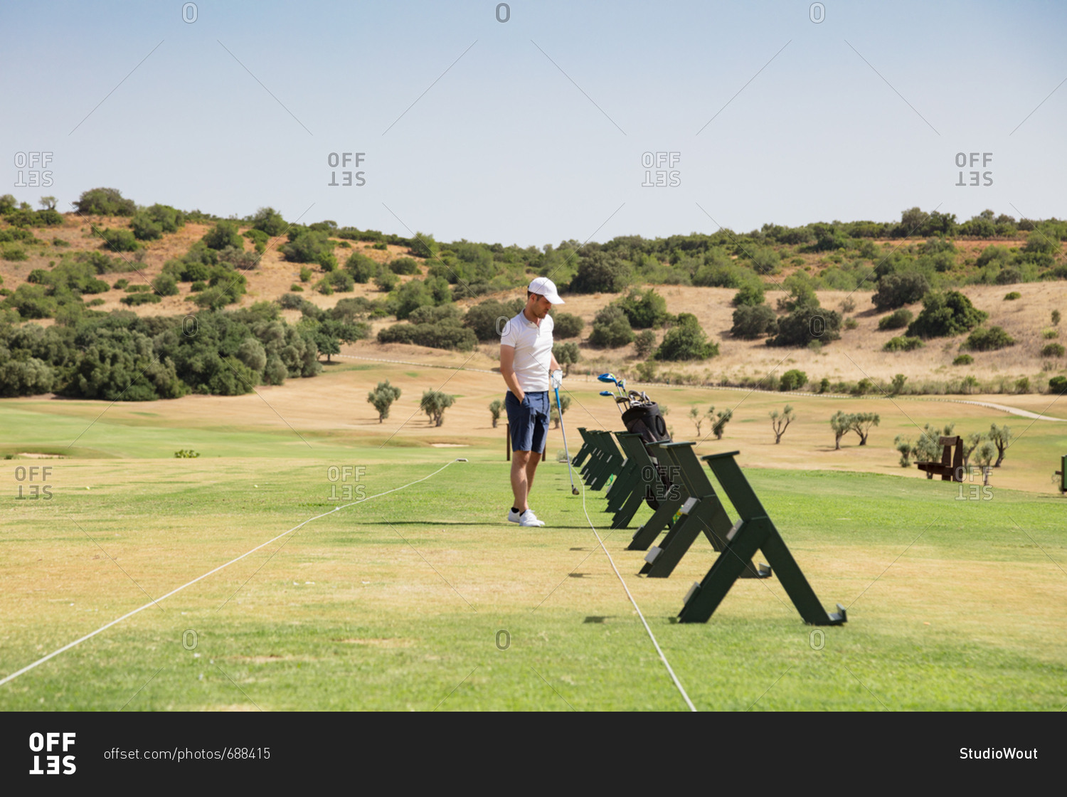 Man on golf driving range in nature