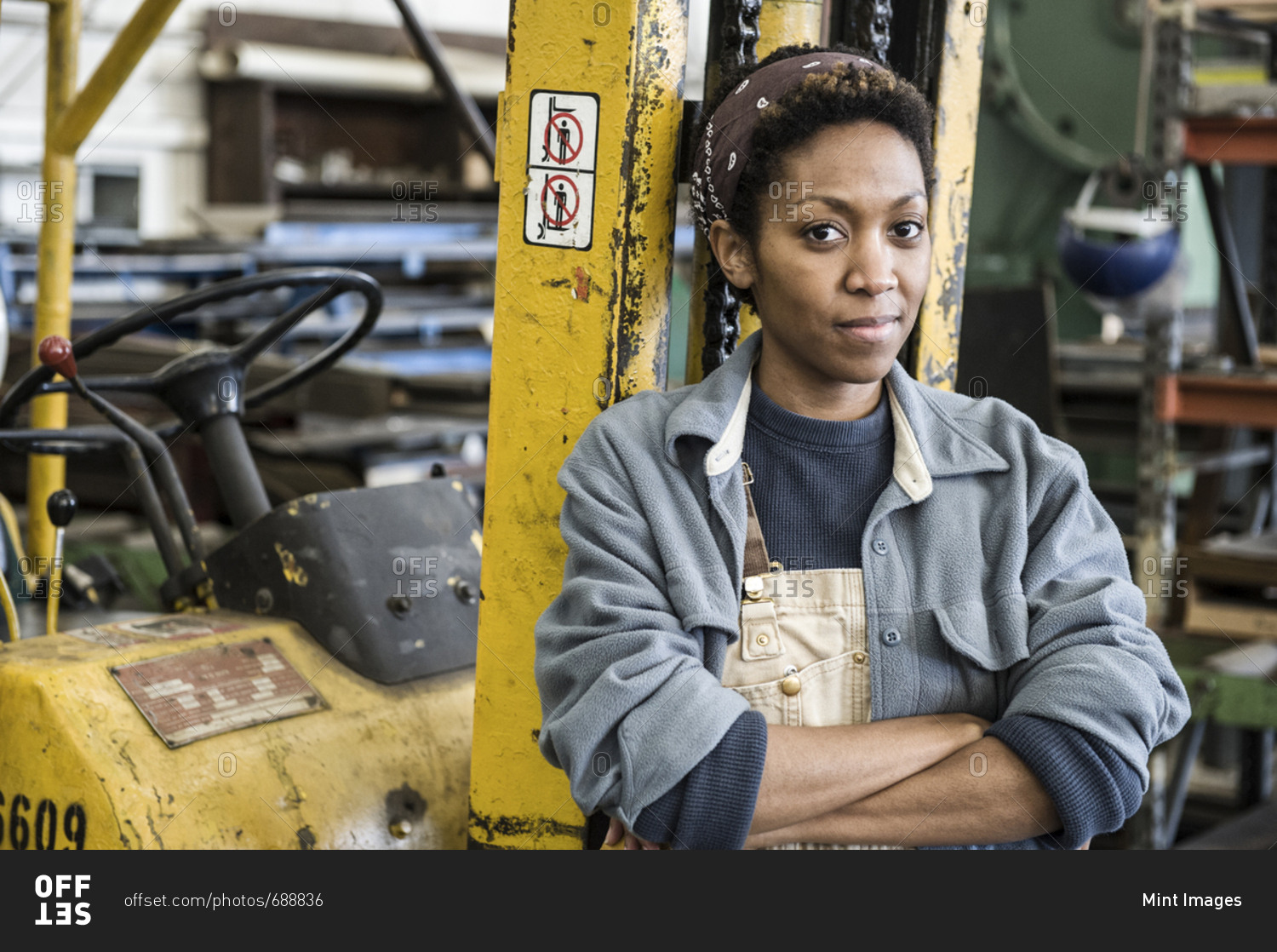 She works at factory. Factory worker woman. Offset woman.