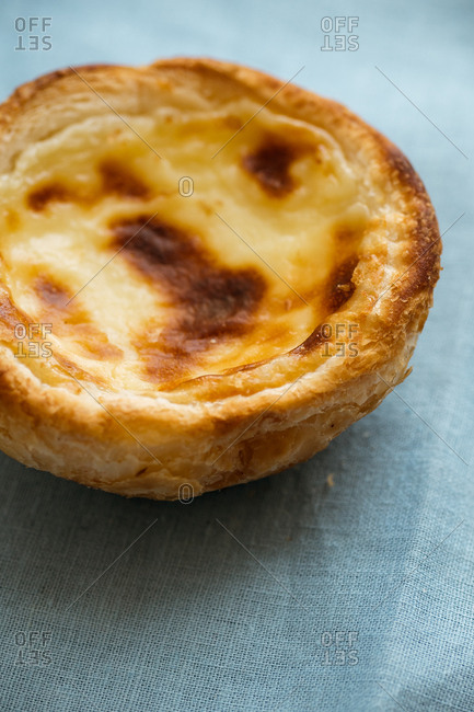 Close up of traditional portuguese dessert pasteis de belem - baked puff pastry with custard