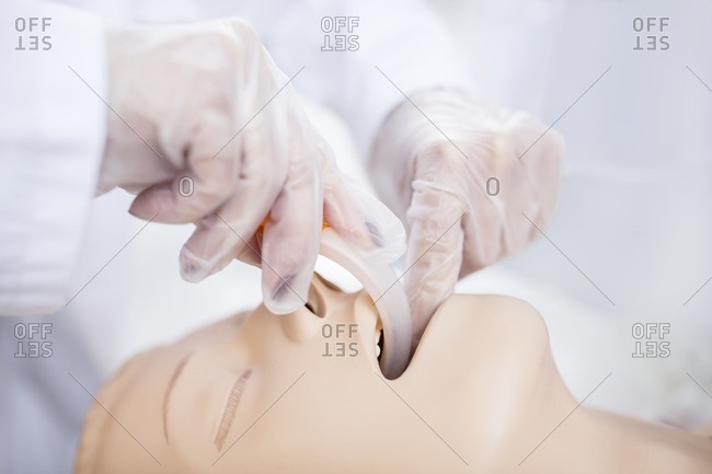 Doctor practicing intubation on a dummy