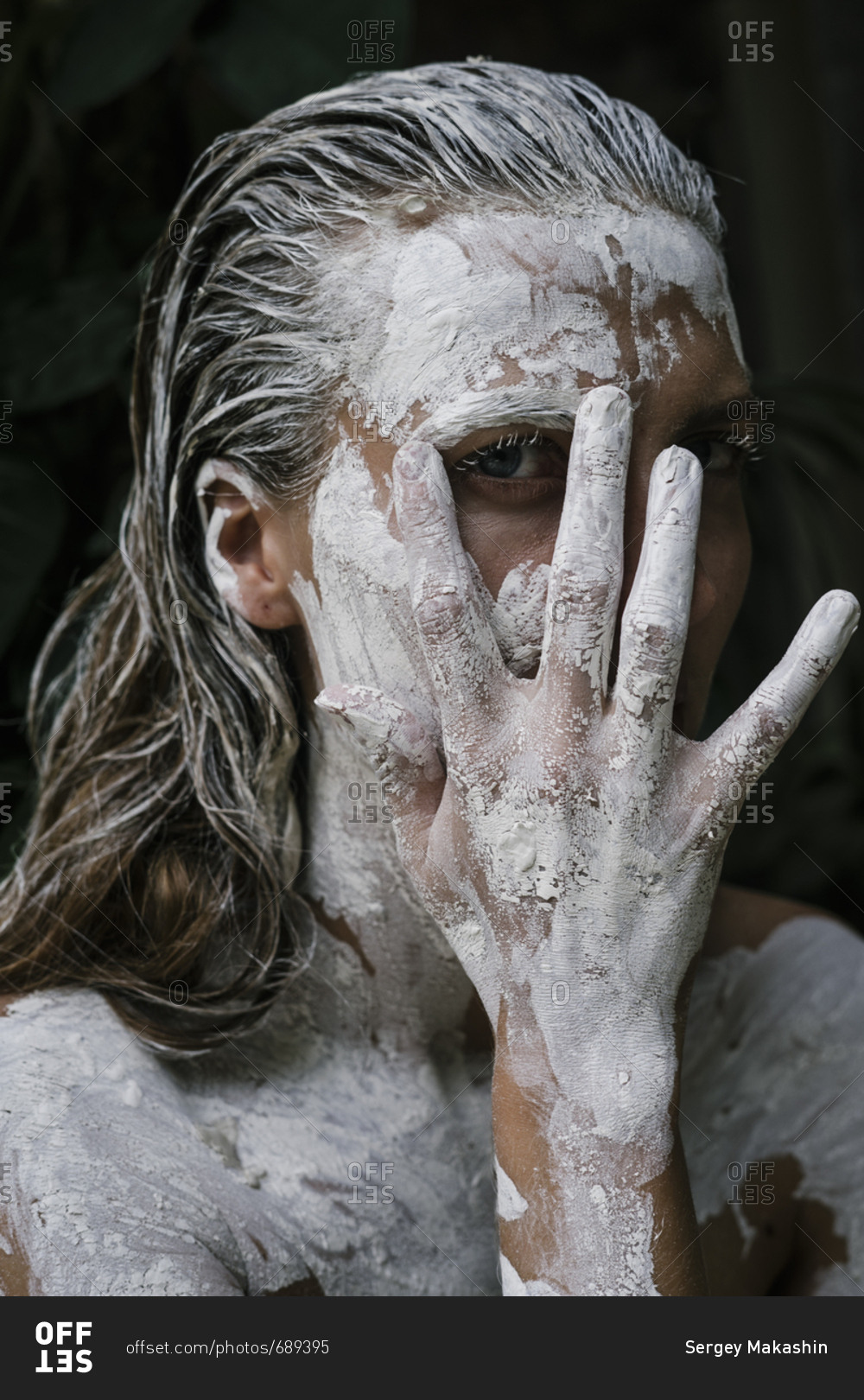 Close-up of woman applying white paint … – License image – 10171462 ❘ Image  Professionals