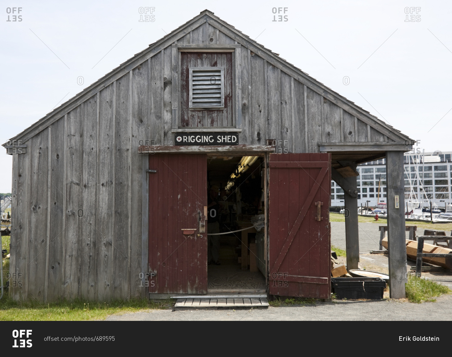 Old weather beaten wooden shed in marina in Boston