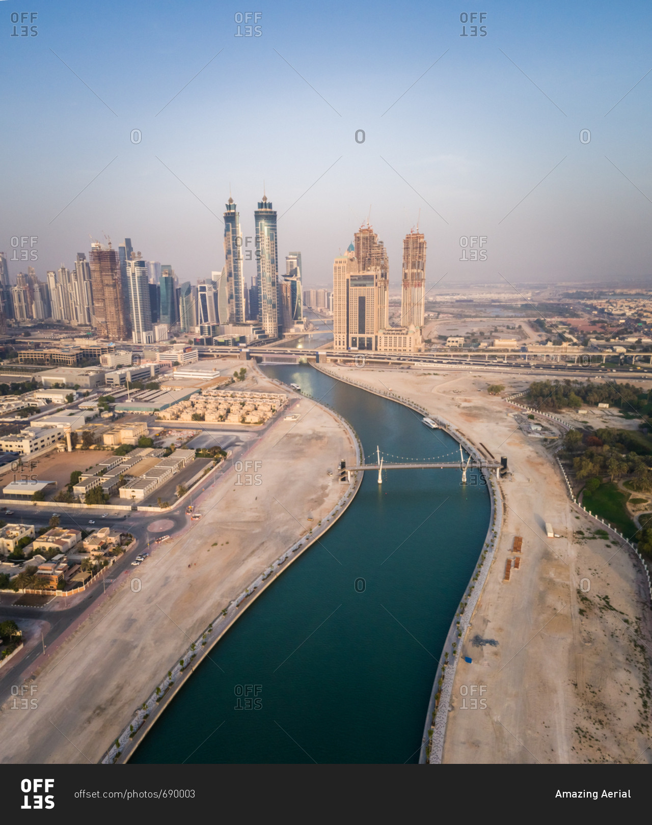 Aerial view of Dubai canal and skyscrapers in U.A.E. stock photo - OFFSET