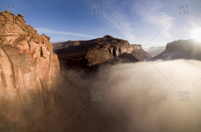 USA, Utah, Moab, Aerial view of cliffs above Colorado River near Arches National Park on winter morning