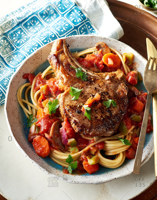 Top down view of hearty Cast Iron Pork Cacciatore stock photo - OFFSET