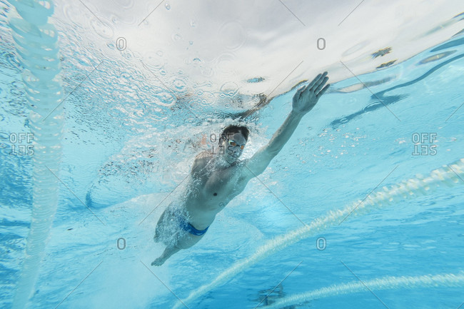 April 11, 2017: Underwater view of Olympic swimmer training in pool, Tenerife, Canary Islands, Spain