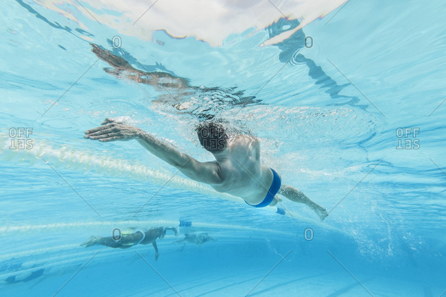 April 11, 2017: Underwater view of Olympic swimmer training in pool, Tenerife, Canary Islands, Spain