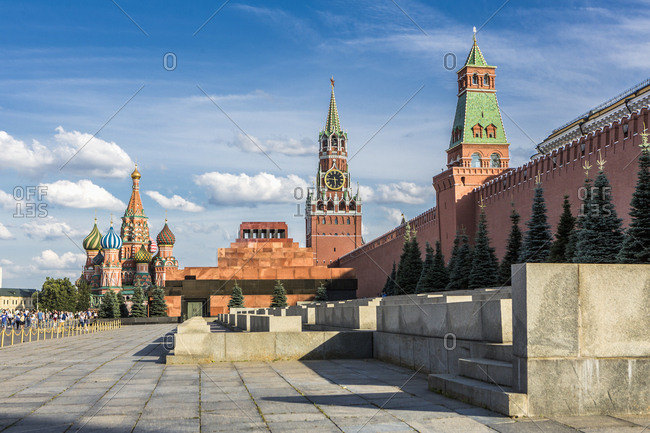 Red Square, the Lenin Mausoleum and the Moscow Kremlin with the walls, the Senate Tower, the Spasskaya (Saviour Tower) Tower, the Cathedral of Vasily commonly known as Saint Basil's Cathedral on the left