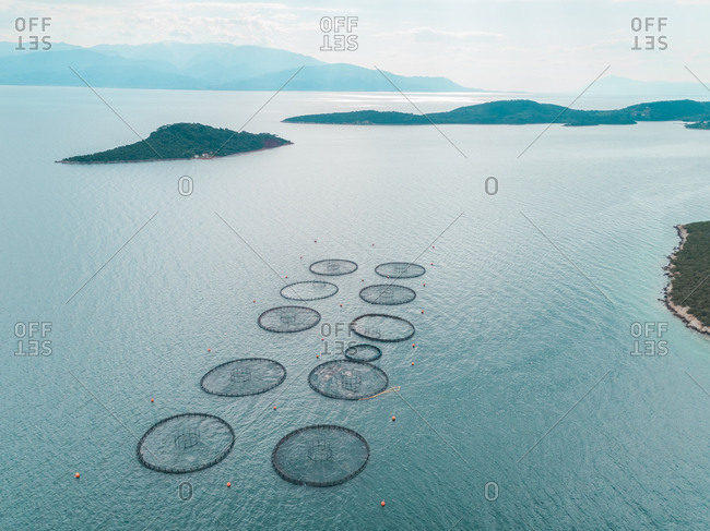 Aerial view of the round fish farm pools in the Mediterranean sea, Greece