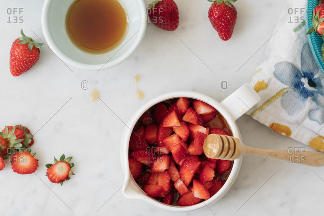 Overhead view of strawberry and honey recipe ingredients