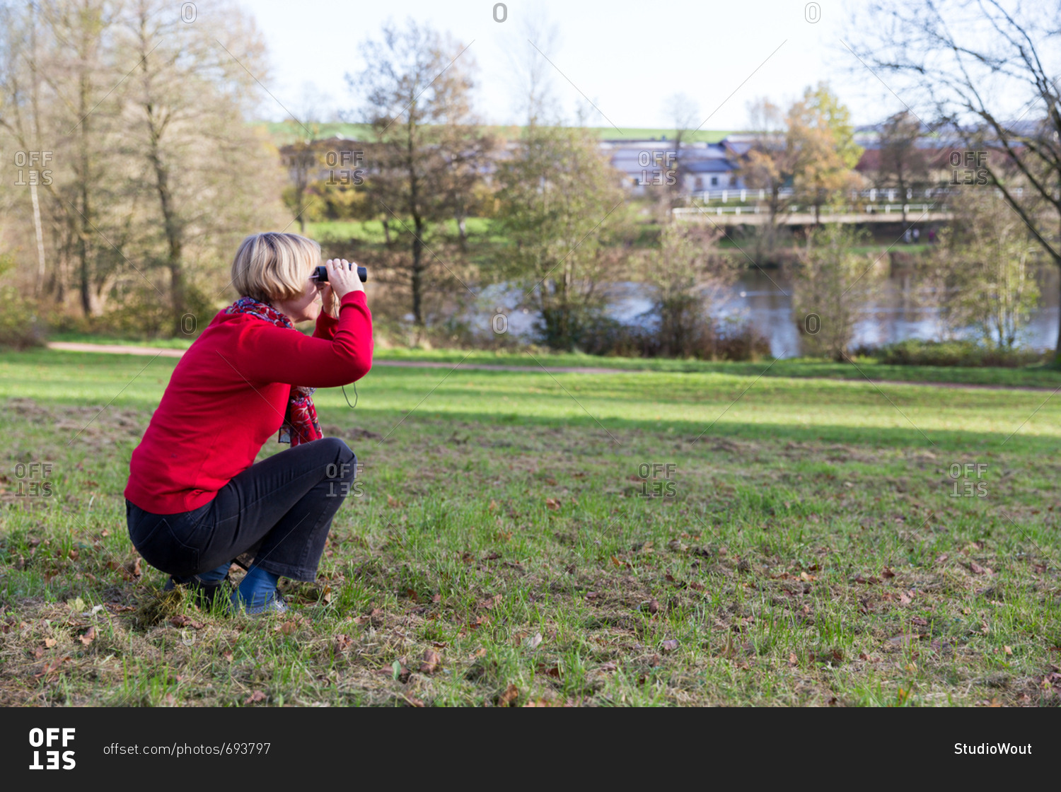Senior woman looking through binoculars