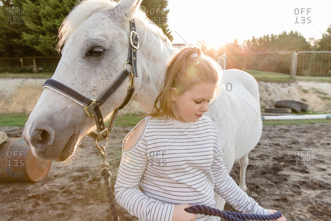 Girl standing with horse - Offset