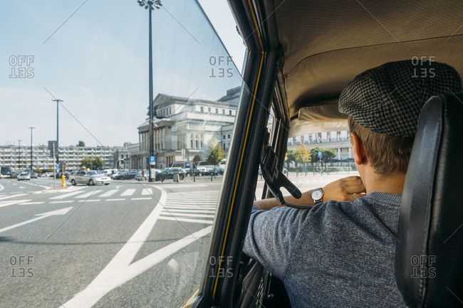 Rear view driving car in city