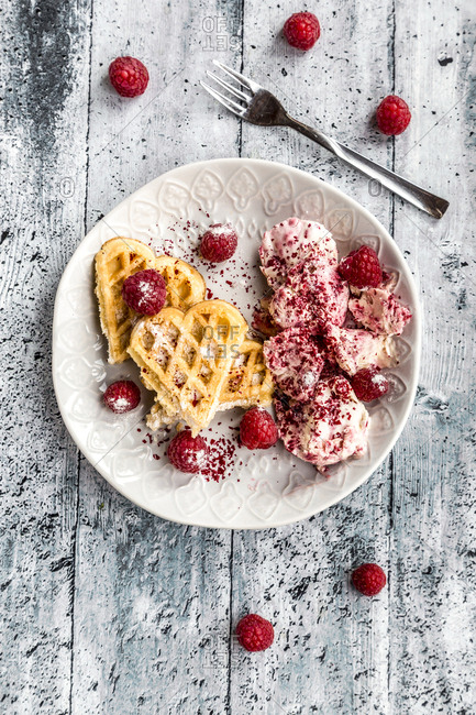 Homemade waffles with raspberry ice cream- waffle hearts with raspberries