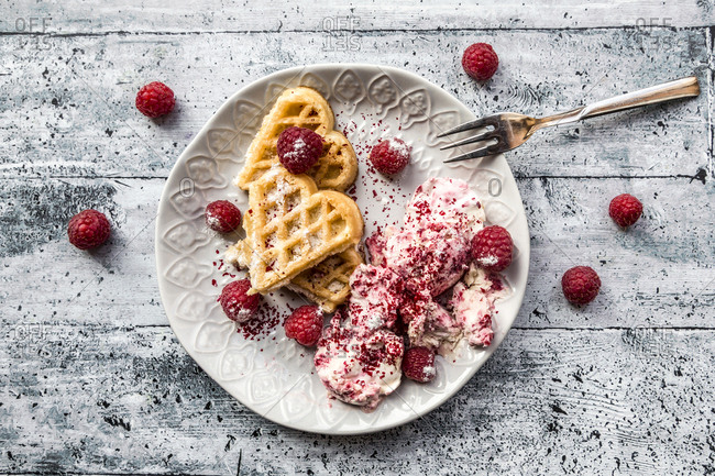 Homemade waffles with raspberry ice cream- waffle hearts with raspberries