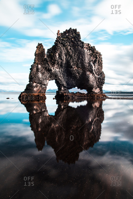 Unique rock formation reflected in water