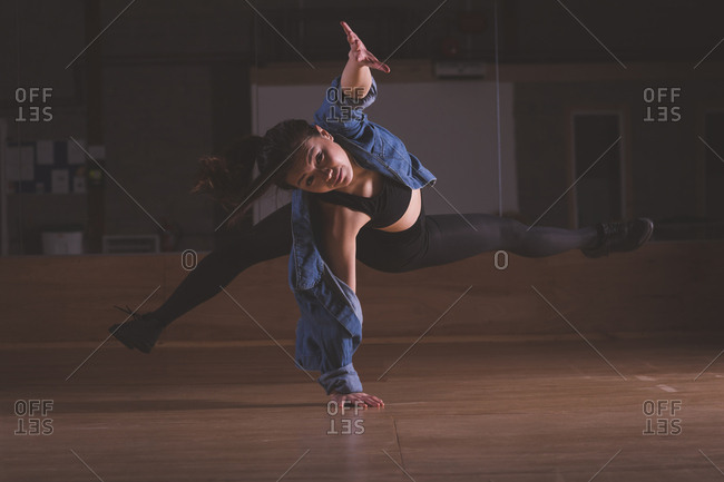 Young female dancer dancing in dance studio