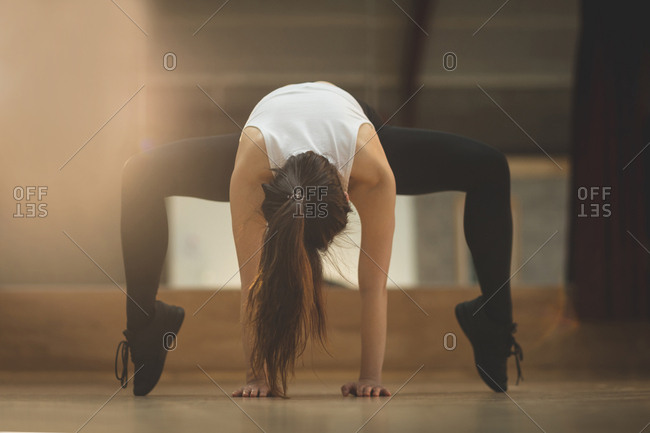 Young female dancer dancing in dance studio