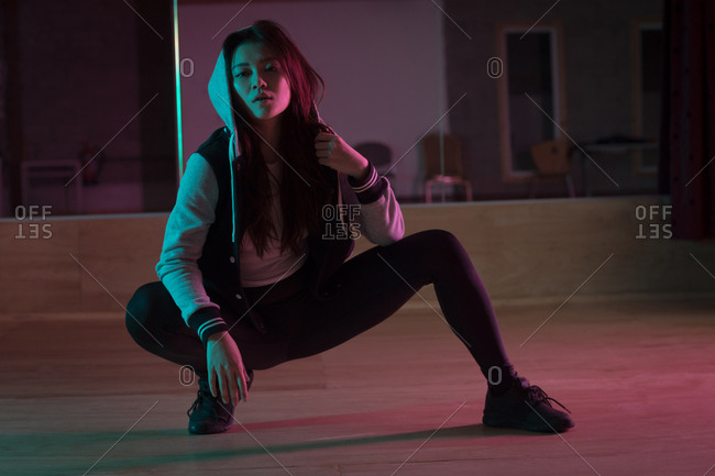 Young female dancer dancing in dance studio