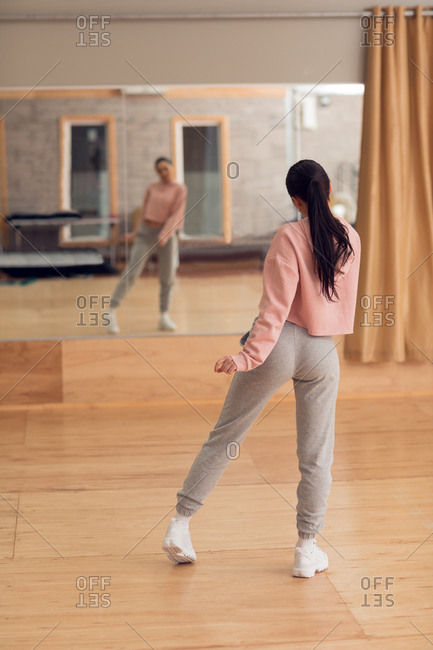 Young female dancer dancing in dance studio