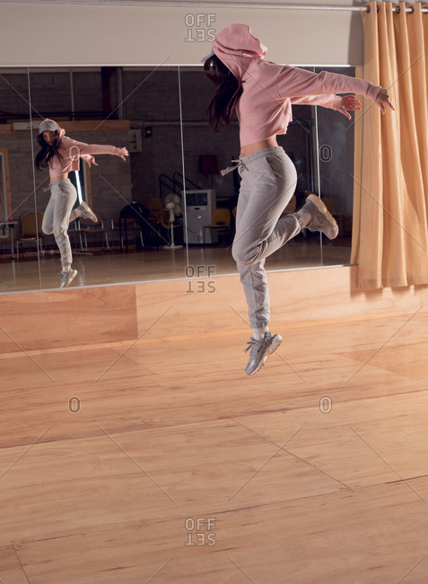 Young female dancer dancing in dance studio