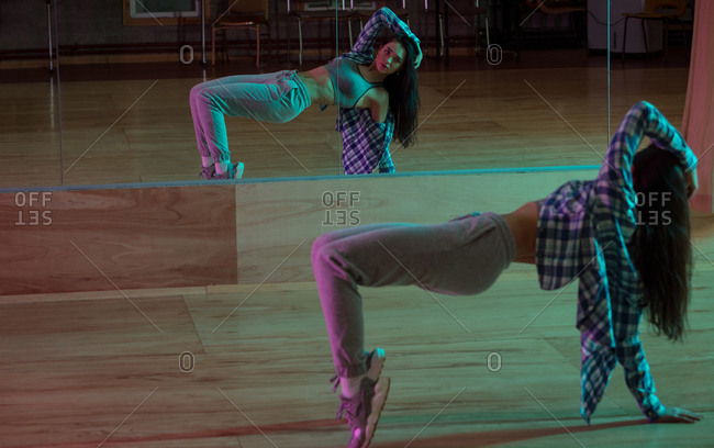 Young female dancer dancing in dance studio